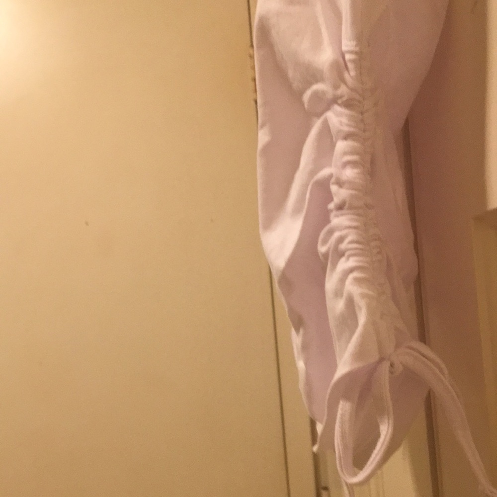 Cute white tee with rouched sides great for anytime wear size small